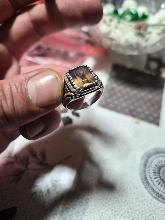 Men's silver-tone ring with a large square amber stone and engraved band